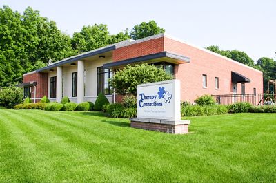 The Therapy Connections building in Beavercreek, with its sign on a green lawn
